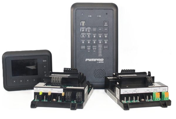 Assorted electrical control modules and a wall-mounted remote panel on a white background.